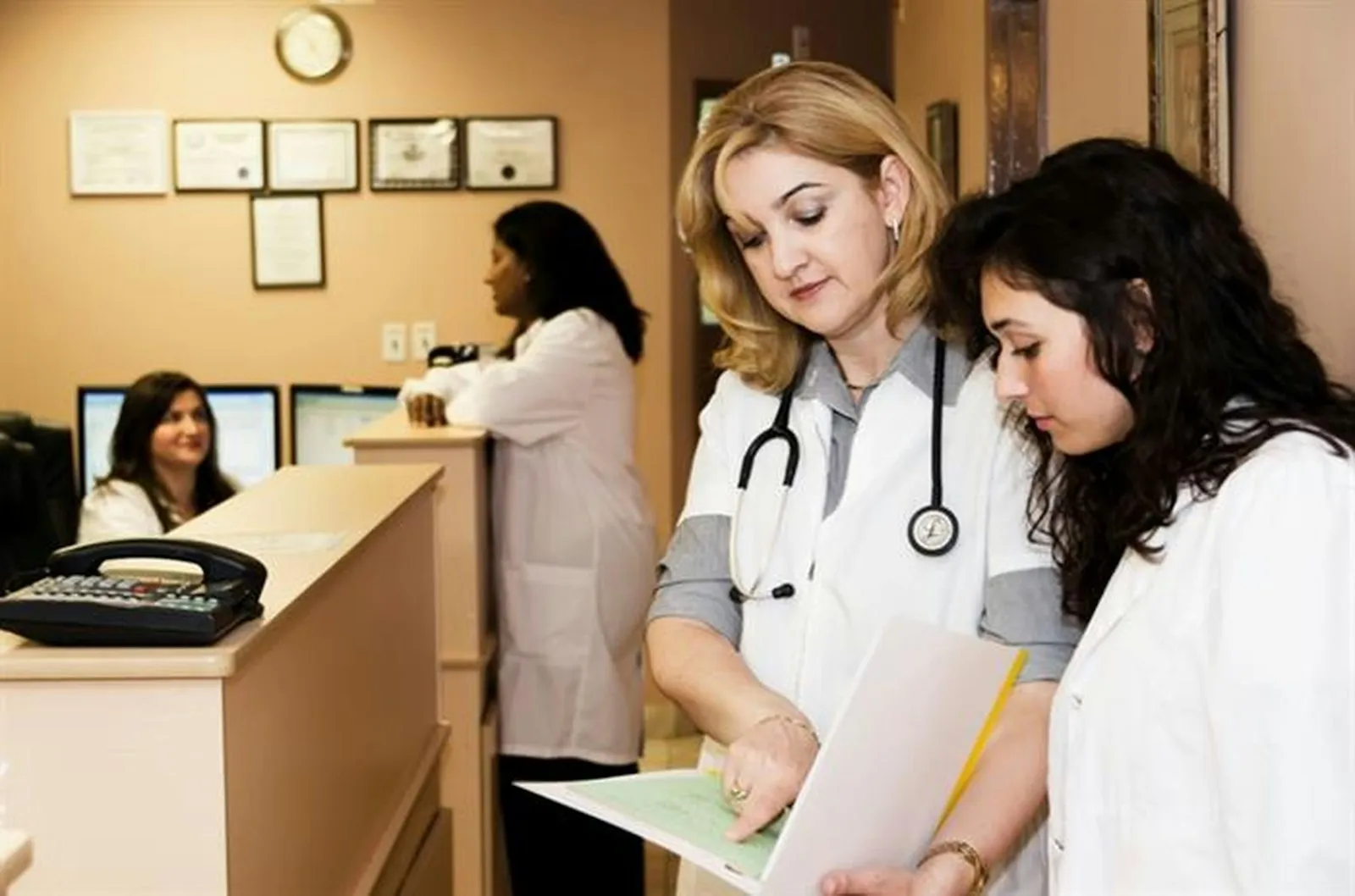 A welcoming healthcare reception and front-desk area.